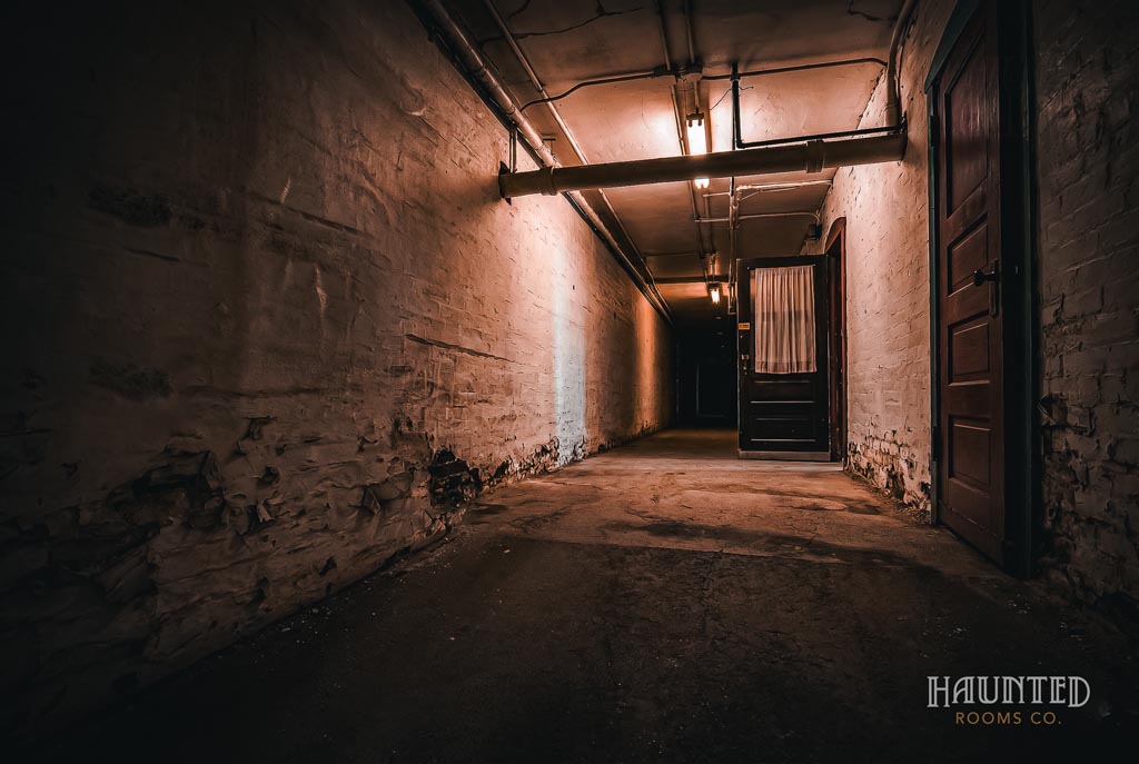 Dark, eerie hallway with doorss