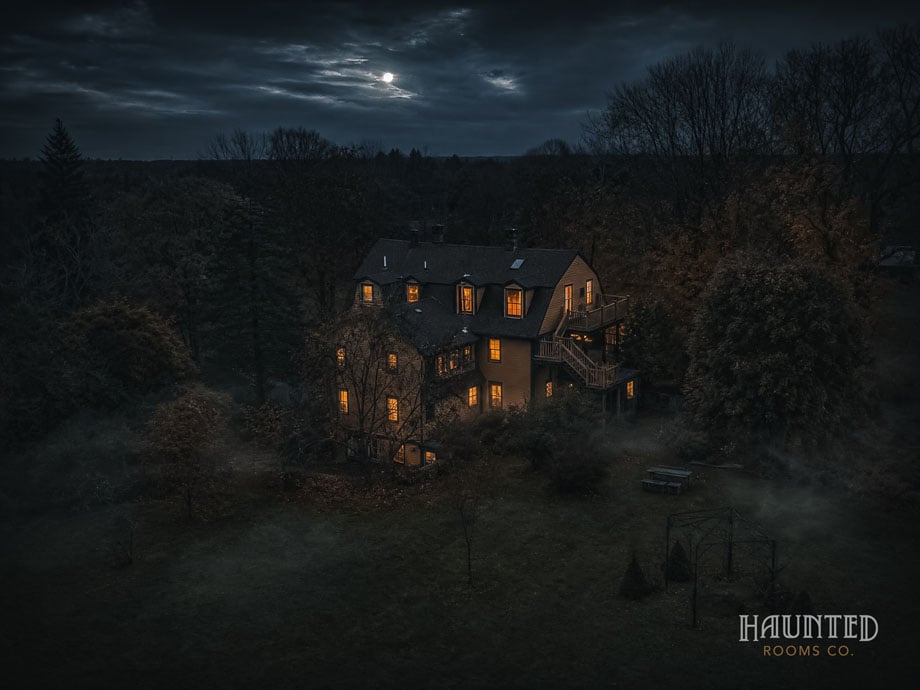 Rear of Captain Grant's 1754 inn and its deck from above under a full moon