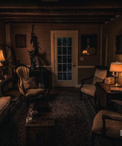 Lamp-lit sitting room at Captain Grant's 1754 at night