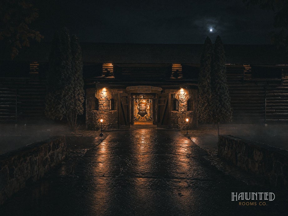 Fort William Henry gatehouse lit by lanterns at night, Lake George NY ghost hunt
