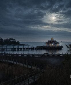 Marsh and boardwalk at night looking out to the Roanoke Marshes Lighthouse, Manteo