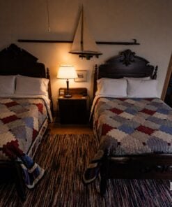 Room 2 with two full beds at the Roanoke Island Inn at night