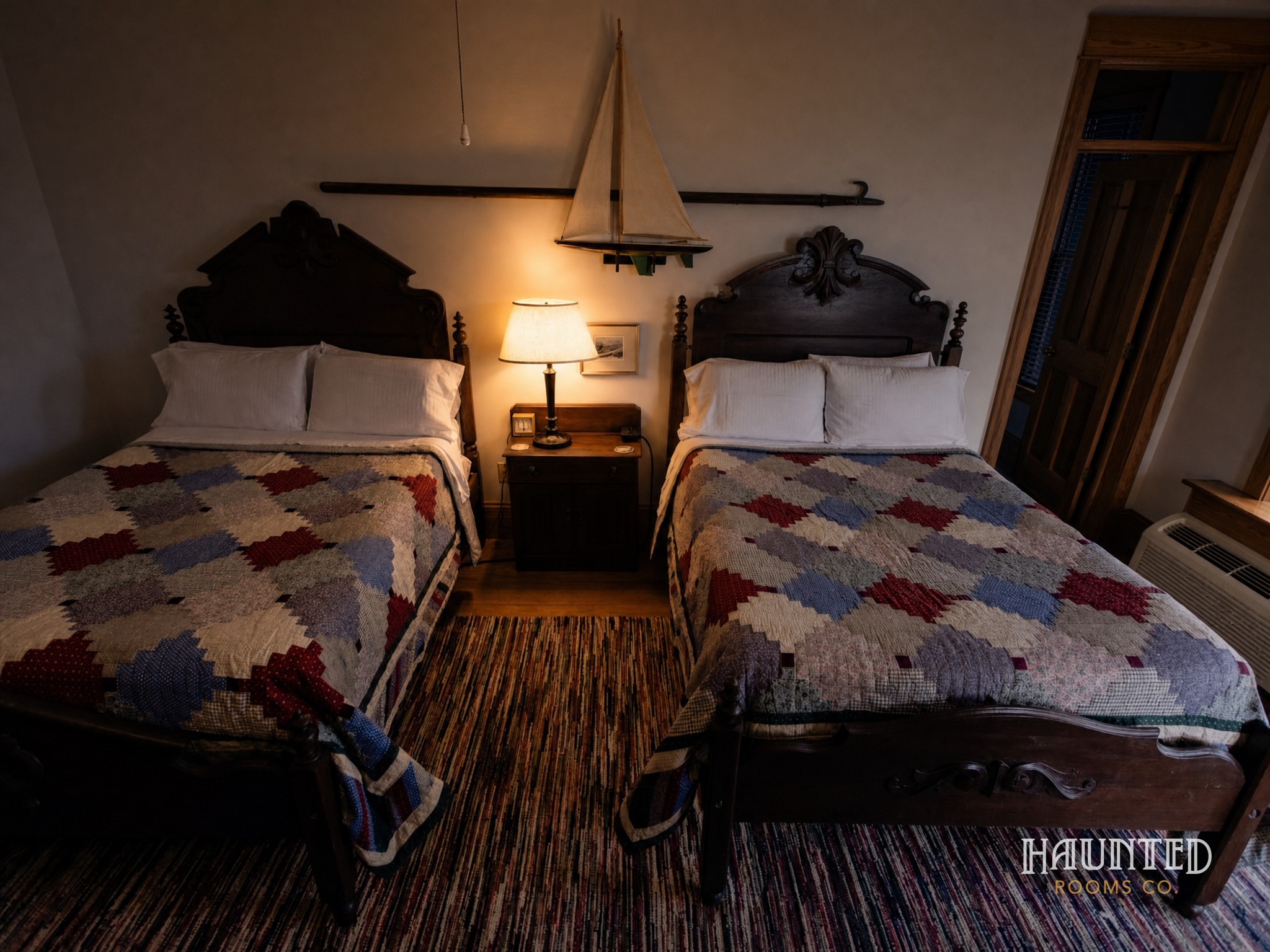 Room 2 with two full beds at the Roanoke Island Inn at night