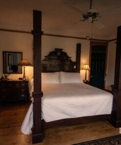Room 3 four-poster bed at the Roanoke Island Inn at night