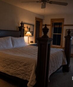 Room 5 four-poster king room at the Roanoke Island Inn at night